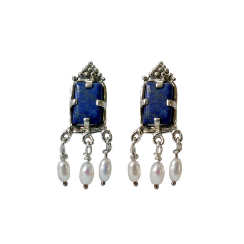 silver earrings with lapis lazuli and pearls displayed on a neutral background